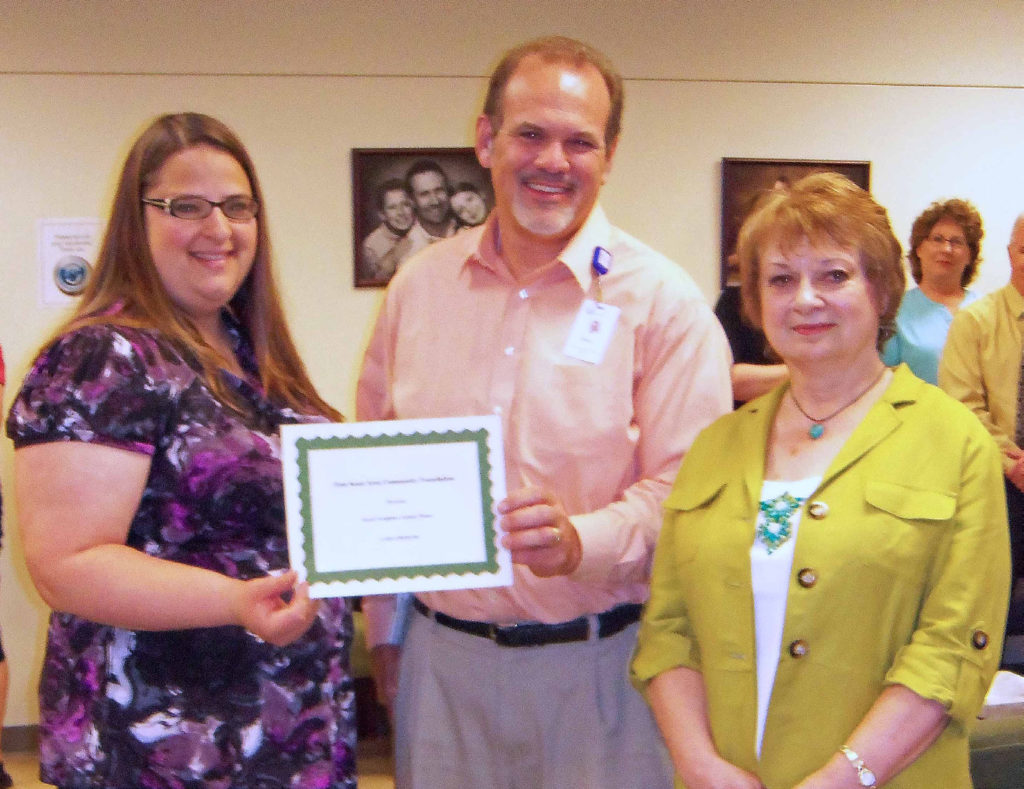 Treva Williams and Craig Campbell receive an FSACF grant by Granting Committee Chairperson Carol MacArthur.